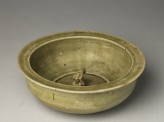 Greenware basin with small kneeling figure