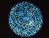 Bowl with animals against a foliate background