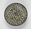 Bowl with flying phoenixes against a foliate background