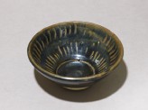 Black ware bowl with stripes