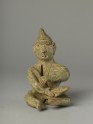 Greenware burial figure of man playing a harp