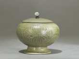 Globular greenware jar with lotus flower decoration