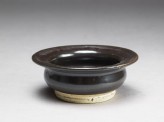 Black ware bowl with iron glaze