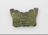 Part of a sword hilt with interlinking hooks and curls