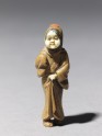 Netsuke in the form of a figure wearing a mask of Okame, a merry Shinto goddess (EA1956.1736)