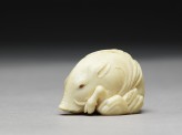 Netsuke in the form of a wild boar among grass