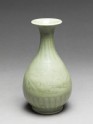 Greenware vase with floral decoration