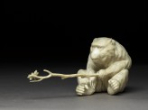 Okimono, or ornament, in the form of a monkey holding a branch