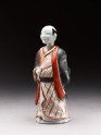 Figure of a man holding a fan