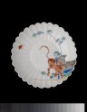 Fluted saucer dish with a tiger and butterfly