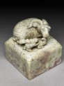 Soapstone seal surmounted by a ram and two lambs