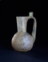 Glass jug with raised disc decoration