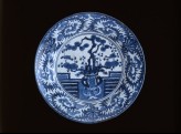 Dish depicting a vase of prunus and pine