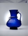 Blue glass jug with naskhi inscription