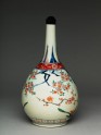 Bottle with flowering prunus and peach trees