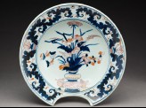 Barber's bowl depicting flowers in a vase