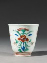 Cup with formal floral design