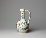 Jug with formal flower sprays and birds