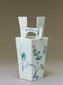 Vase with camellia tree and two birds
