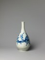 Bottle with seaweed and shell decoration