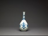 Bottle with formal lotus flower and leaf sprays