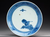 Plate with two birds under a cloud
