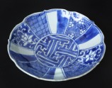 Blue-and-white dish with flowers and geometric decoration