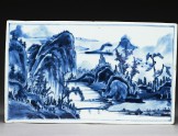 Blue-and-white tile with a landscape on one side and flowers on the other (EA1978.1174)