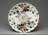 Fluted saucer dish with floral decoration