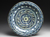Dish with central six-pointed star and concentric bands of geometric decoration