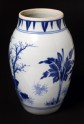 Blue-and-white jar with mythical figures in a landscape