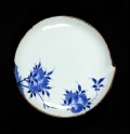 Blue-and-white dish with flowering peach branches