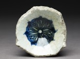 Base fragment of a bowl with blue rosette