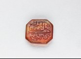 Octagonal bezel seal with nasta‘liq inscription, spiral, and floral decoration