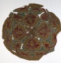 Roundel fragment with interlacing vines and leaves (EA1984.133)