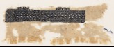 Textile fragment with linked diamond-shapes and arrows (EA1984.188)