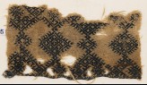 Textile fragment with linked diamond-shapes and hooks (EA1984.195)