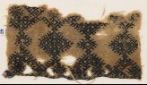 Textile fragment with linked diamond-shapes and hooks