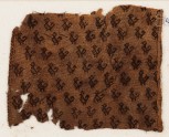 Textile fragment with birds with curving tails, probably from a tunic