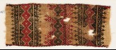 Textile fragment with bands of linked squares, crosses, triangles, and leaves