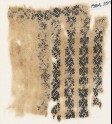 Textile fragment with bands of S-shapes, hooks, and leaves