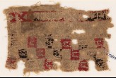 Textile fragment with squares and pseudo-inscription