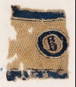 Textile fragment with circle and pseudo-inscription (EA1984.275)