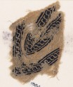 Textile fragment with linked scrolls of S-shapes, possibly from a garment