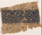 Textile fragment with linked diamond-shapes, triangles, and flowers