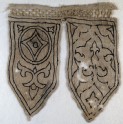 Tabs from a banner with fleur-de-lys, blazon, and trefoils