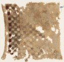 Textile fragment with swastika-filled squares (EA1984.398)