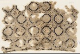 Textile fragment with circles set into a grid