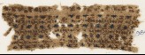 Textile fragment with diamond-shapes in squares (EA1984.421.a)