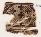 Textile fragment with diamond-shapes against a background of dots (EA1984.457)